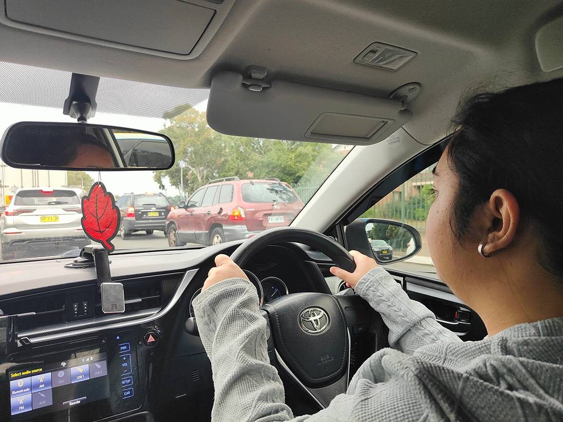 A learner driver scanning traffic ahead from the driver&rsquo;s seat of a Sydney South Driving School car